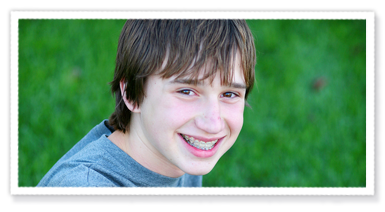 stock photo of a teen boy with braces